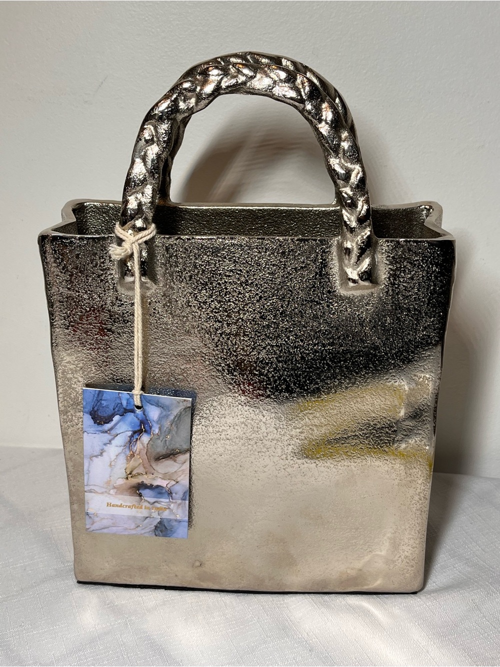 Metallic Silver Structured Tote Handbag decor
New
Made India